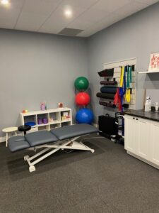 Waterdown Village Chiropractic & Wellness Group physiotherapy space. Image shows exercise equipment and treatment table